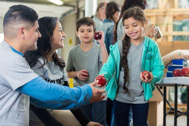 volunteering and handing out healthy foods