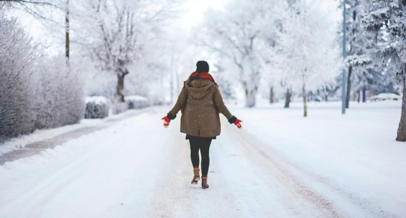 Woman walking in snow