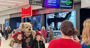 Kids posing with Cavs mascot