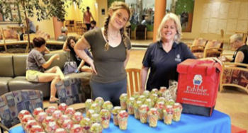 Geauga YMCA staff gives out fruit cups to the community in need